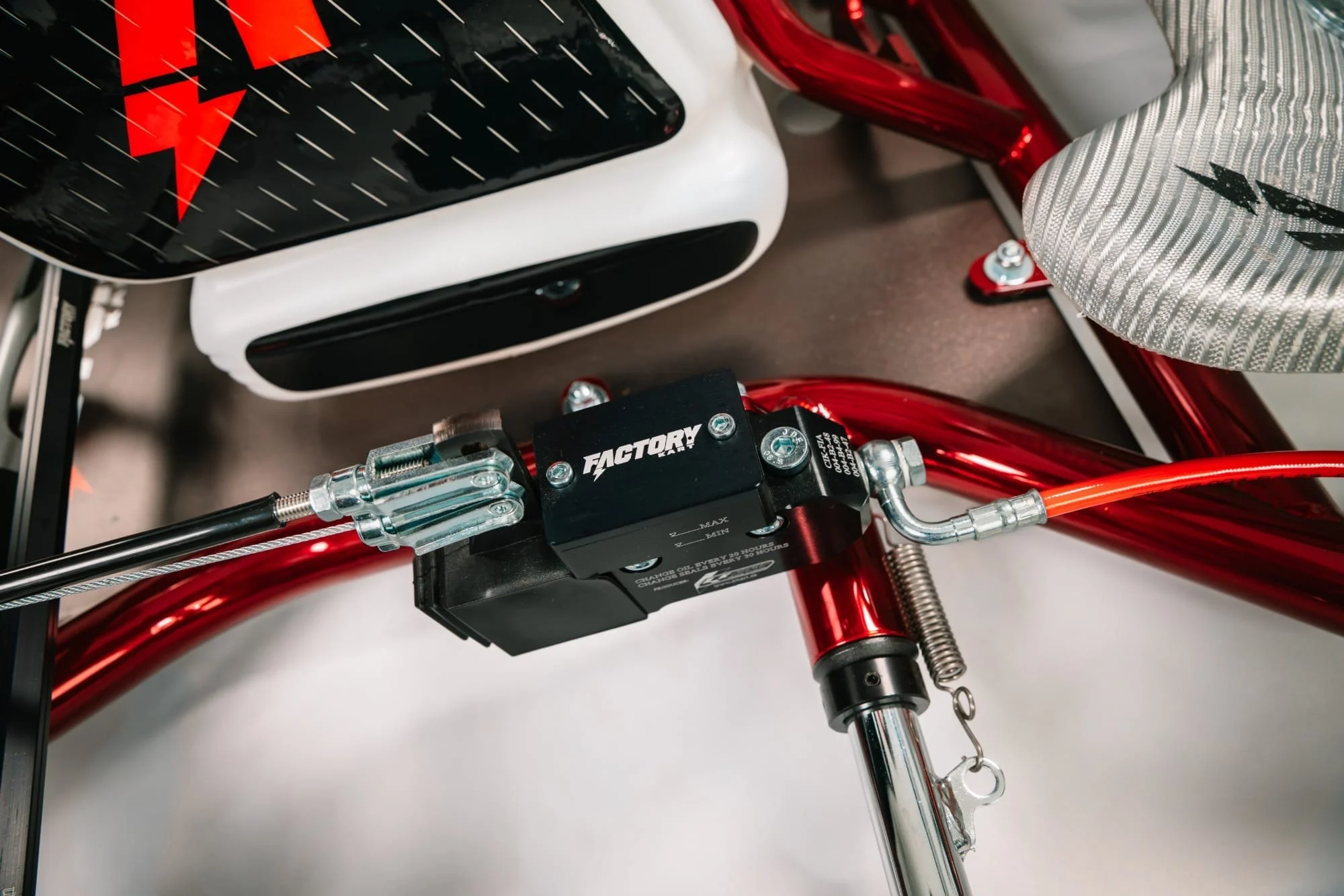 Factory Karts brake master cylinder on the red chrome frame