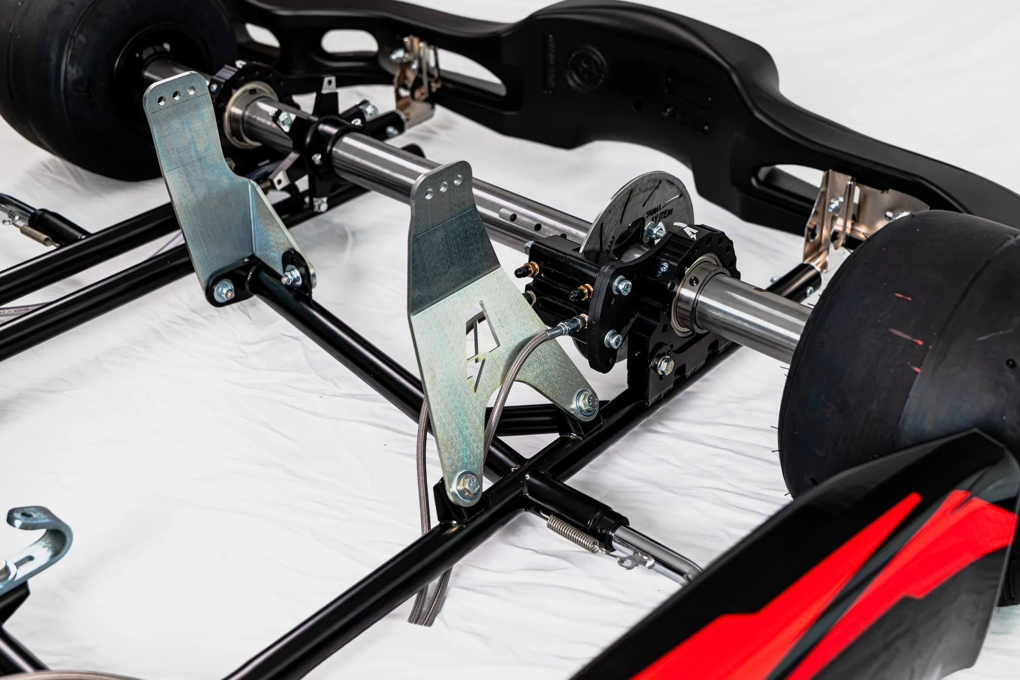 Rear axle and bearing carrier