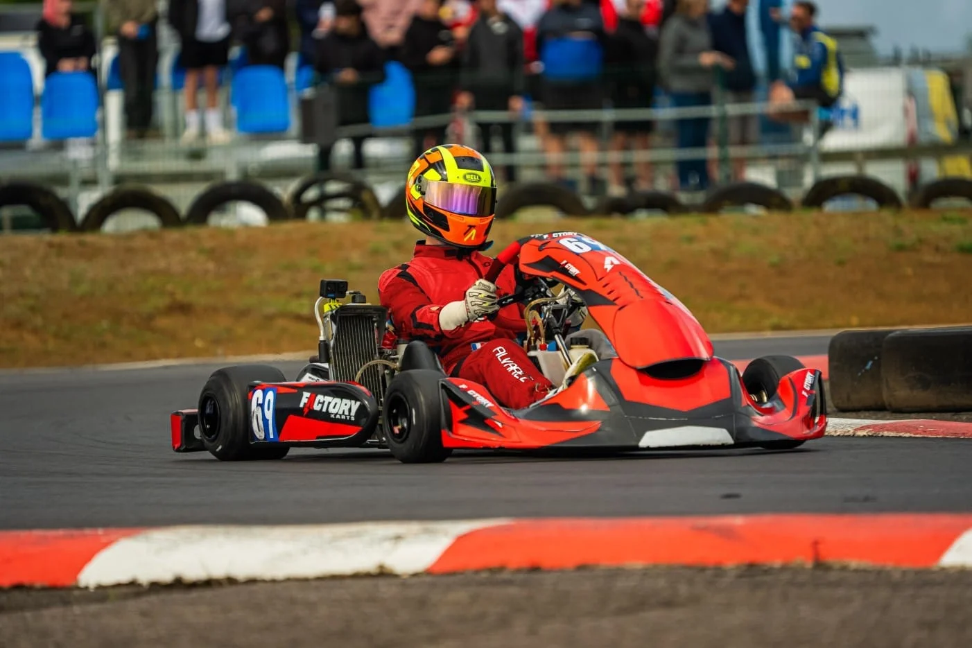 Factory Karts chassis racing past the crowd on a race weekend